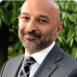 Portrait of Jas Anand, Senior Fraud Executive at Feedzai, specializing in financial crime risk management.