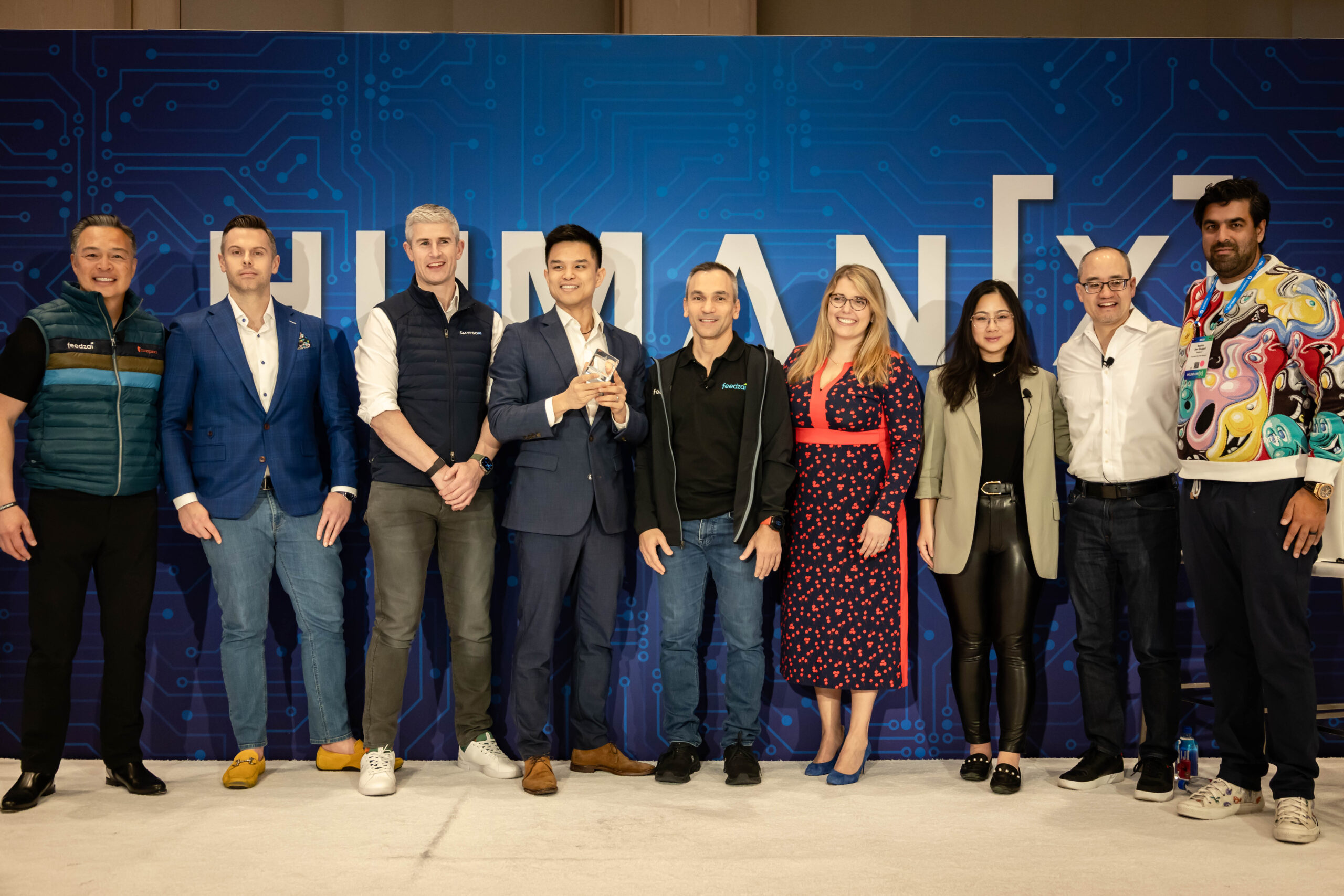 Photo of winners of Feedzai TRUST Innovation Challenge at HumanX, show representatives from Ferrum Health, Stratyfy, CalypsoAI, and Arcanna.ai.