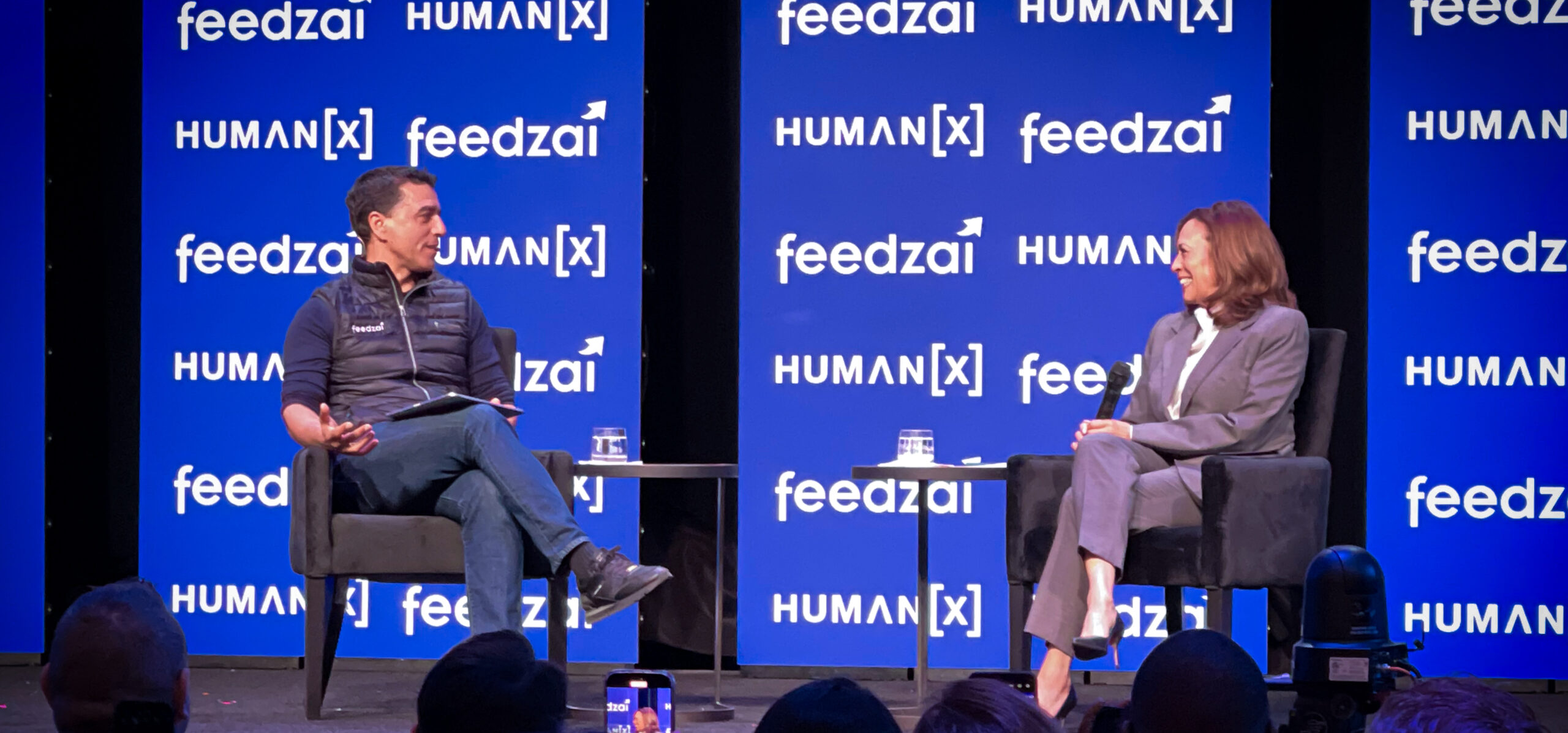 Photograph of Feedzai CEO Nuno Sebastiao and former Vice President Kamala Harris at a fireside chat at HumanX in Las Vegas.